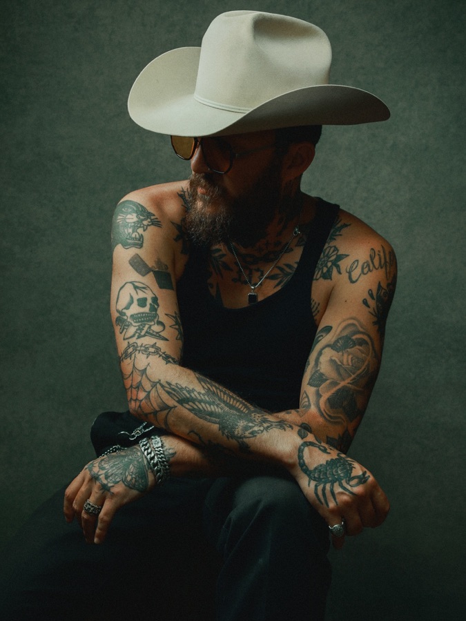Jarrod Anthonee — studio portrait of a tattooed cowboy