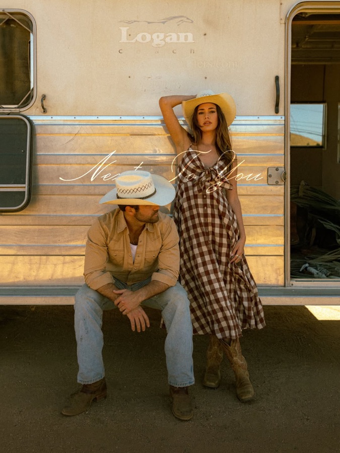 Kayden Muzila — western couple campaign against a horse trailer